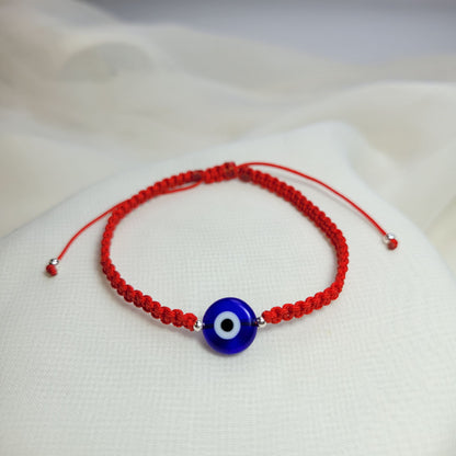 Pulsera ojo turco Azul e Hilo rojo aclilico